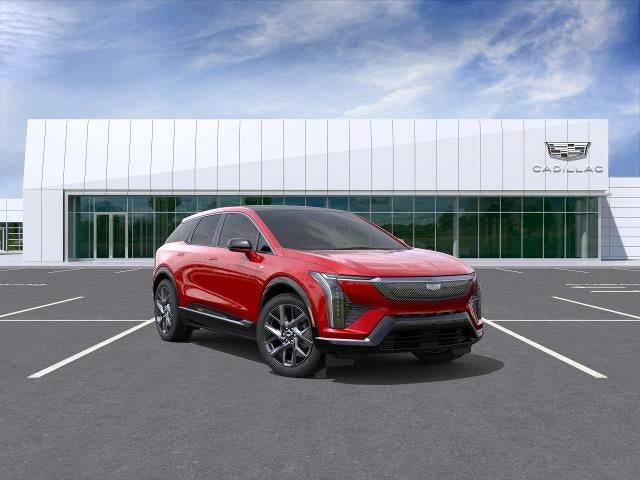 2026 Cadillac OPTIQ Luxury in Radiant Red Tintcoat — front three-quarter view