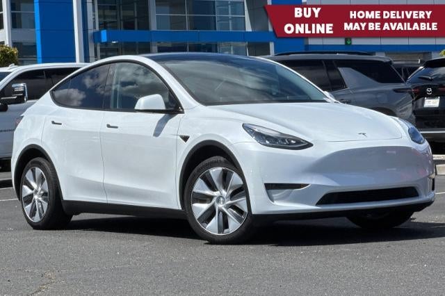 2023 Tesla Model Y Long Range in White — front three-quarter view
