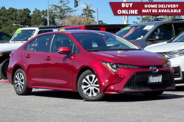 2022 Toyota Corolla Hybrid LE in Red — front three-quarter view